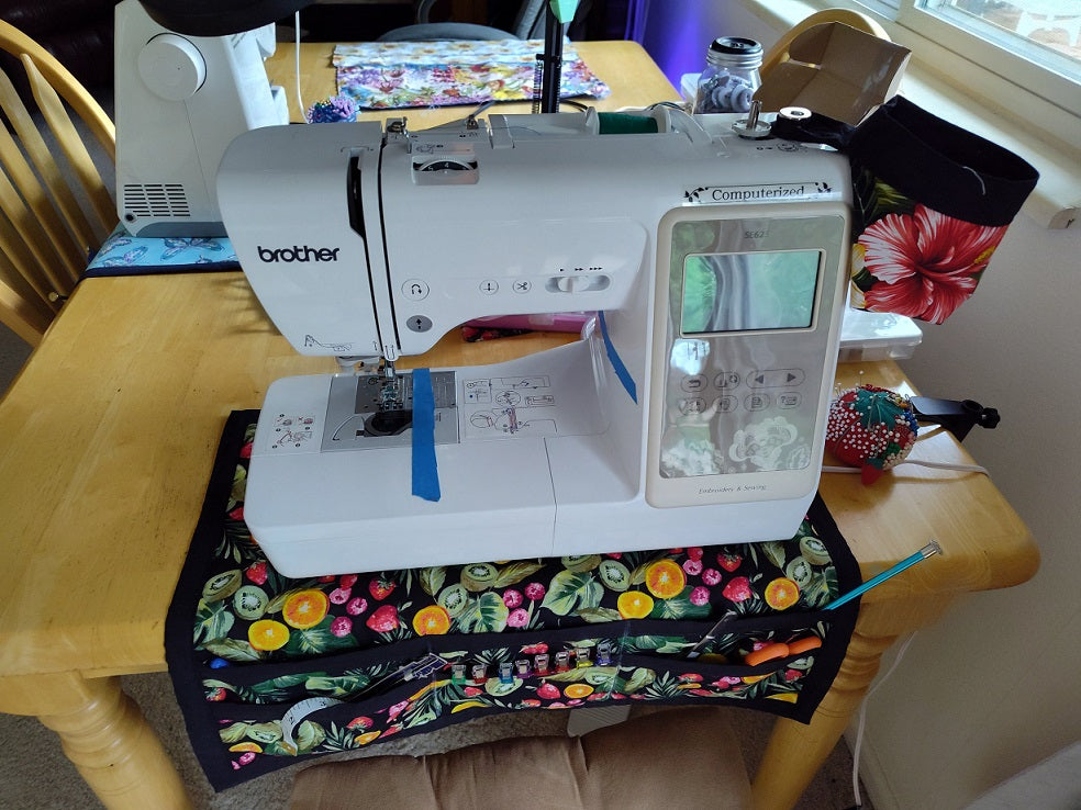 Sewing machine sitting on Sewing Machine Mat