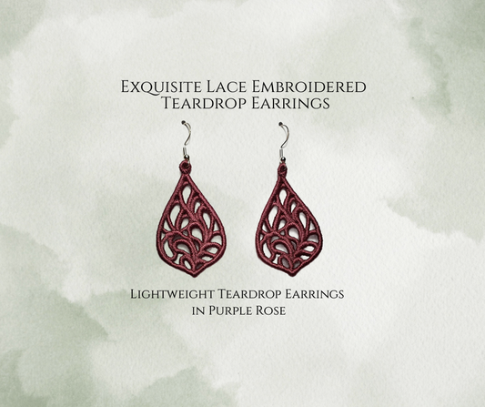 Lightweight Embroidered Exquisite Teardrop Lace Earrings in Purple Rose. Available with Sterling Silver ear wires.
On a mottled light green background.